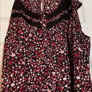 Sleveless flowy dress shirt.